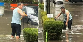 폭우에 바지 걷고 배수로 뚫은 민소매 男…알고 보니 ‘도의원’이었다