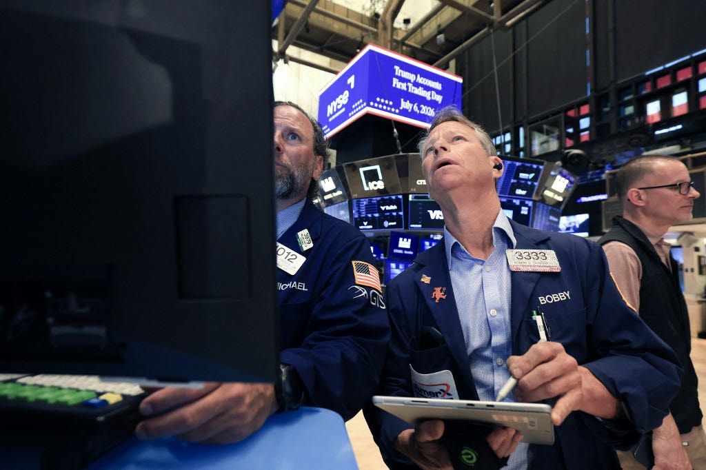 Traders moments before US President Donald Trump rings the opening bell of the New York Stock Exchange (NYSE) in New York on July 6, 2026 from the Oval Office in celebration of the First Day of trading of Trump Accounts (Photo by TIMOTHY A. CLARY / AFP)