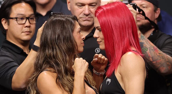 UFC 여성 스트로급 챔피언 매켄지 던(왼쪽)과 도전자 질리언 로버트슨이 계체를 마친 뒤 신경전을 벌이고 있다. 사진=UFC